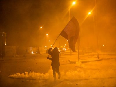 Anti-government protesters and riot police clash during a second day of violence, on January 22, 2020 in Beirut, Lebanon