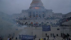 Police officers stand guard as supporters of U.S. President Donald Trump gather in front of the U.S. Capitol building