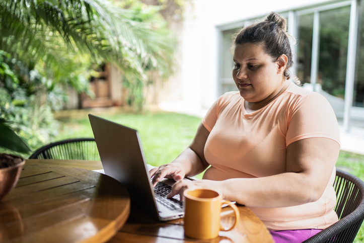 Portrait of a mid adult woman working on the laptop at home