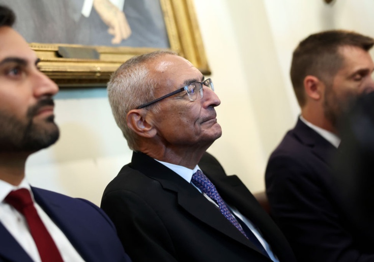 John Podesta welcomed a loyal supporter at the White House, as revealed by visitor logs